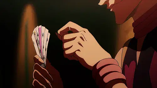 西索举起一手扑克牌的动图，其中一些牌面方向错误